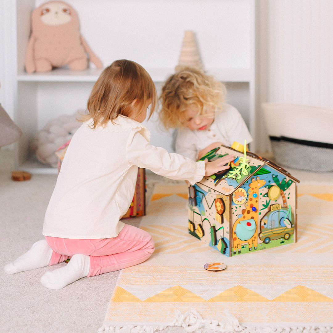 Wooden educational busy activity board of the shape of the house